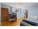 Bedroom featuring hardwood floors, a large desk, a bookcase, and a view of the outdoors at 10826 Livingston Dr, Northglenn, CO 80234