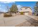 A long concrete driveway leads to a well-maintained two-story home with an attached garage at 10826 Livingston Dr, Northglenn, CO 80234