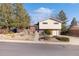 Charming two-story home featuring a blend of brick and light siding, a well-maintained front yard and driveway at 10826 Livingston Dr, Northglenn, CO 80234