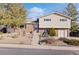 Charming brick and vinyl two-story home with a well-maintained front yard and mature trees at 10826 Livingston Dr, Northglenn, CO 80234