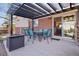 Covered patio with outdoor dining furniture at 10826 Livingston Dr, Northglenn, CO 80234