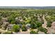 An aerial view of a residential neighborhood with mature trees and well-maintained houses at 2249 Weatherstone Cir, Highlands Ranch, CO 80126