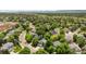 Aerial view of a neighborhood showcasing the houses and mature trees at 2249 Weatherstone Cir, Highlands Ranch, CO 80126