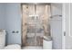 Bathroom showcasing a glass-enclosed shower with decorative tiling and sleek fixtures at 2249 Weatherstone Cir, Highlands Ranch, CO 80126