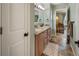 Bathroom with double sinks, granite countertops, and tile flooring, connecting to bedroom at 2249 Weatherstone Cir, Highlands Ranch, CO 80126
