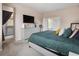 Comfortable bedroom with bed, ensuite bathroom and plenty of natural light at 2249 Weatherstone Cir, Highlands Ranch, CO 80126