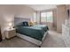 Inviting bedroom with plush carpeting, neutral tones and a comfortable queen bed at 2249 Weatherstone Cir, Highlands Ranch, CO 80126