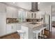 Modern kitchen features center island, stainless steel appliances and bright natural lighting at 2249 Weatherstone Cir, Highlands Ranch, CO 80126