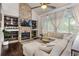 Cozy living room with vaulted ceilings, fireplace and modern decor, filled with natural light at 2249 Weatherstone Cir, Highlands Ranch, CO 80126