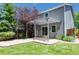 Backyard patio with a stylish pergola and a lush lawn, perfect for outdoor entertaining and relaxation at 7871 Ogden Ct, Denver, CO 80229