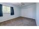 Bright bedroom featuring blue walls, neutral carpet, a ceiling fan, and closet at 7871 Ogden Ct, Denver, CO 80229