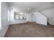 Living room with plush carpet and a view of the kitchen with granite countertops at 7871 Ogden Ct, Denver, CO 80229