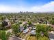 Expansive neighborhood shot featuring mature trees and a panoramic view of Denver's skyline at 3015 N Fillmore St, Denver, CO 80205
