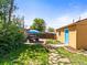 Backyard with a stone pathway, a manicured garden, and a seating area at 3015 N Fillmore St, Denver, CO 80205