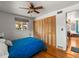Comfortable bedroom with hardwood floors and closet at 3015 N Fillmore St, Denver, CO 80205
