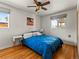 Cozy bedroom featuring a ceiling fan and large windows at 3015 N Fillmore St, Denver, CO 80205