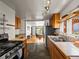 Spacious kitchen with stone floors, stainless steel appliances, and open layout at 3015 N Fillmore St, Denver, CO 80205