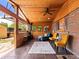 Covered patio with wood ceiling, brick wall, unique windows, and comfortable seating at 3015 N Fillmore St, Denver, CO 80205