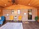 Covered patio with brick wall, wood ceiling, and plush seating at 3015 N Fillmore St, Denver, CO 80205