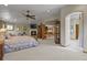 Open concept bedroom with fireplace, bathroom and breakfast nook at 6398 Lost Canyon Ranch Rd, Castle Rock, CO 80104