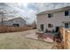 Spacious backyard with patio, ideal for outdoor dining and enjoying the serene surroundings at 11821 W Independence Ave, Lakewood, CO 80401