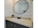 Modern bathroom with vanity, attractive countertop and large oval mirror at 11821 W Independence Ave, Lakewood, CO 80401