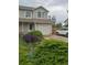 Attractive townhouse with landscaped front yard and convenient parking space at 11821 W Independence Ave, Lakewood, CO 80401