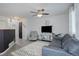 Cozy living room with ceiling fan, plush sofa, and stylish decor at 11821 W Independence Ave, Lakewood, CO 80401