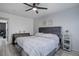 Cozy bedroom with neutral decor and ample space for relaxation and personalization at 11821 W Independence Ave, Lakewood, CO 80401