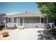 Backyard of a home with a concrete patio, awning, and a mix of gravel and stepping stones at 18656 E Harvard Dr, Aurora, CO 80013
