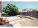 Serene backyard featuring gravel landscaping, a concrete patio, and a wooden privacy fence at 18656 E Harvard Dr, Aurora, CO 80013