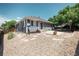 Landscaped backyard with gravel, stone, patio, and wooden fence for privacy at 18656 E Harvard Dr, Aurora, CO 80013