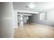 Finished basement features wood-look flooring, recessed lights, and neutral paint, perfect for relaxing at 18656 E Harvard Dr, Aurora, CO 80013