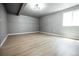 Open basement with wood-look floors, recessed lighting, and neutral paint at 18656 E Harvard Dr, Aurora, CO 80013