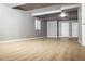 Spacious finished basement with natural light and wood-look floors offers versatile living space at 18656 E Harvard Dr, Aurora, CO 80013