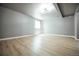 Finished basement with wood-look floors and recessed lighting, perfect for a home theater at 18656 E Harvard Dr, Aurora, CO 80013