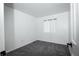 Bright bedroom with plush carpeting and a window offering natural light at 18656 E Harvard Dr, Aurora, CO 80013