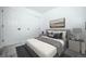 Stylishly staged bedroom featuring a sliding-door closet and contemporary decor at 18656 E Harvard Dr, Aurora, CO 80013