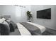 Stylish bedroom with a mounted TV, sleek decor, and a relaxing ambiance at 18656 E Harvard Dr, Aurora, CO 80013