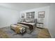 Relaxing bedroom features a plush bed, stylish lamps, and comfortable seating at 18656 E Harvard Dr, Aurora, CO 80013