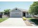 Charming home featuring a two-car garage and covered porch, perfect for suburban living at 18656 E Harvard Dr, Aurora, CO 80013
