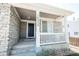 Inviting front porch with stone accents, creating a welcoming entrance to the home at 18656 E Harvard Dr, Aurora, CO 80013