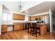 Bright kitchen featuring stainless steel appliances and a functional center island with bar stool seating at 18656 E Harvard Dr, Aurora, CO 80013