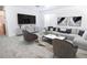 Bright living room boasts modern decor, neutral colors, and comfortable seating arrangement at 18656 E Harvard Dr, Aurora, CO 80013