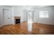 Spacious living room with hardwood floors, fireplace and lots of natural light at 18656 E Harvard Dr, Aurora, CO 80013