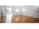 Light-filled living area with hardwood floors, a fireplace, and access to the outdoors at 18656 E Harvard Dr, Aurora, CO 80013