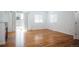 Bright living room with wood floors, neutral walls, and large sliding glass doors at 18656 E Harvard Dr, Aurora, CO 80013