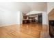 Open-concept living space with hardwood floors seamlessly connecting to the adjacent kitchen at 18656 E Harvard Dr, Aurora, CO 80013
