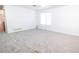Spacious living room with neutral walls and plush carpet at 18656 E Harvard Dr, Aurora, CO 80013