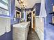 Nicely appointed bathroom featuring double sinks, subway tile surround tub, and modern fixtures at 2540 Forest St, Denver, CO 80207